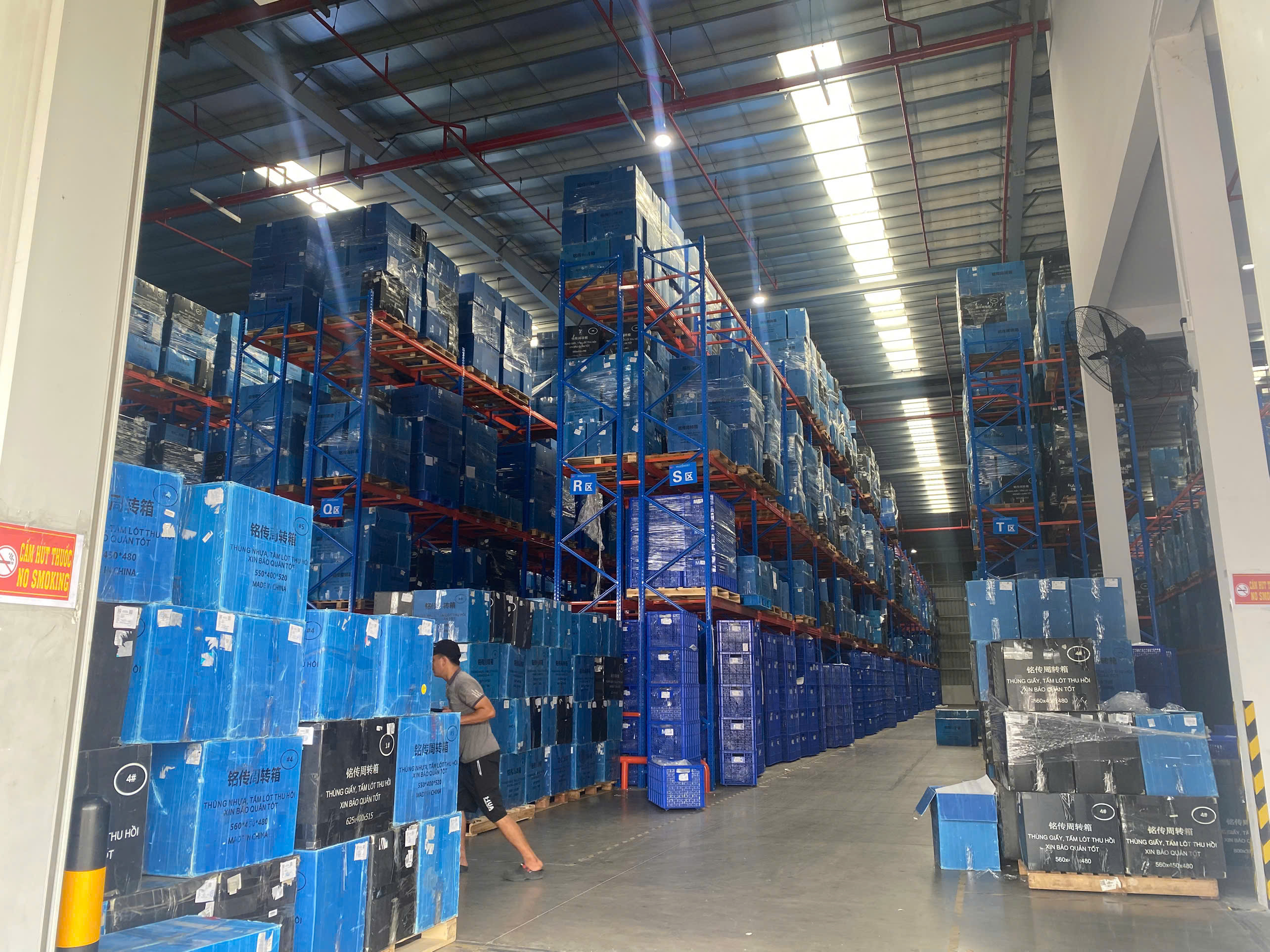 High racking with neatly organized goods in warehouse.jpg